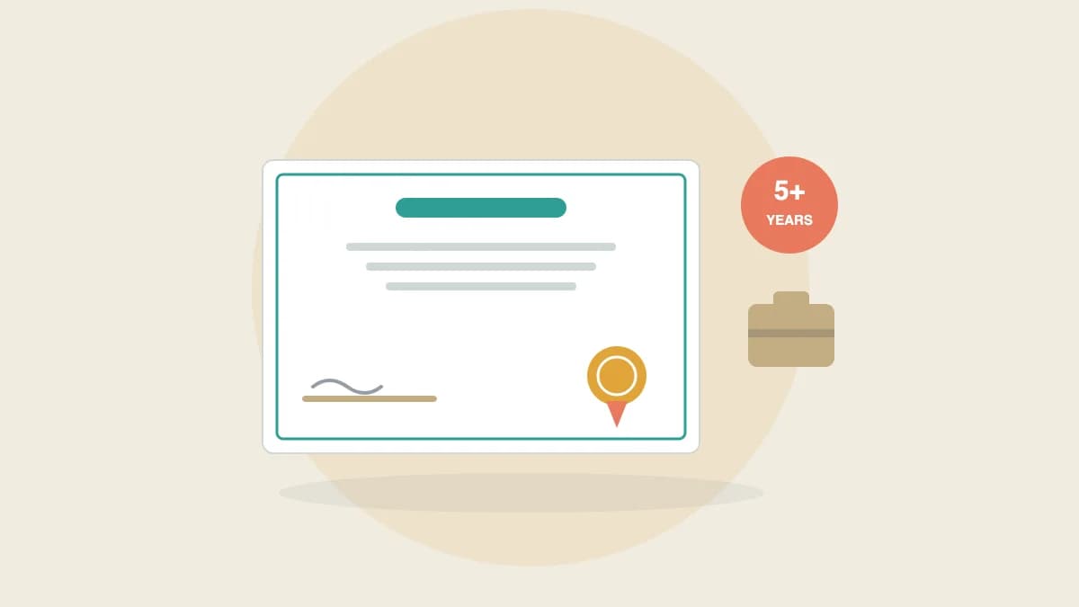 An Indian employee holding a printed experience certificate on company letterhead beside a laptop showing an HR letter draft.