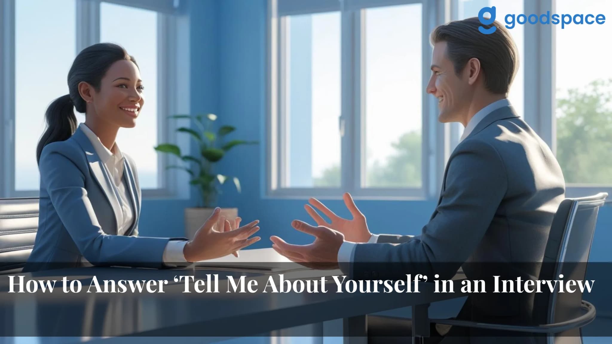 Candidate and interviewer talking across a table in a bright blue room, both hands mid gesture